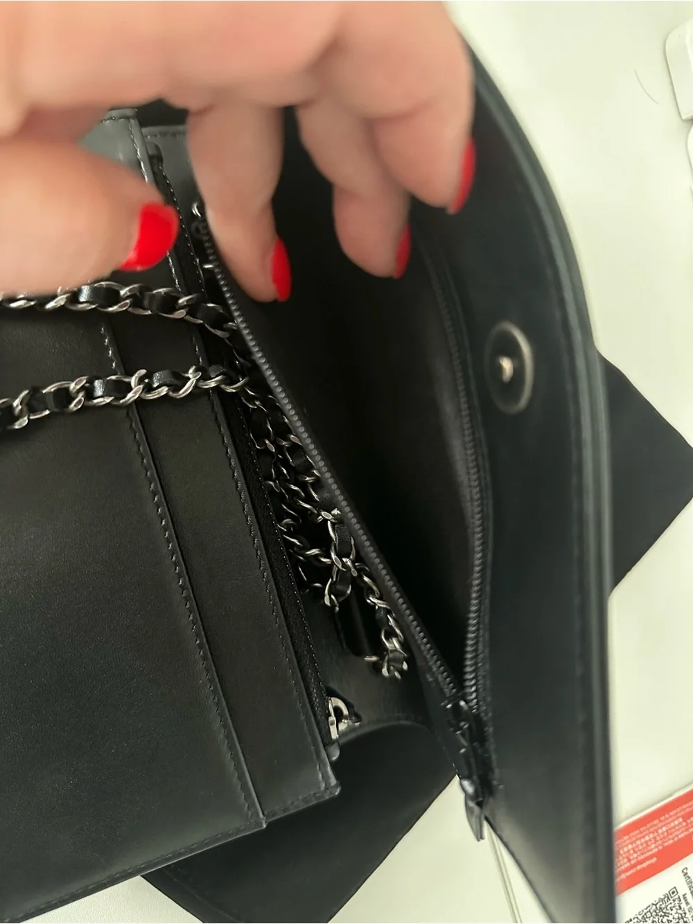 CHANEL Black Leather Clutch with Mixed Metal Chain Script